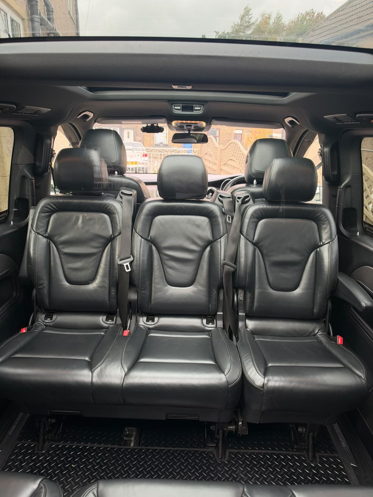 Leather passenger seating and panoramic roof inside a fleet vehicle