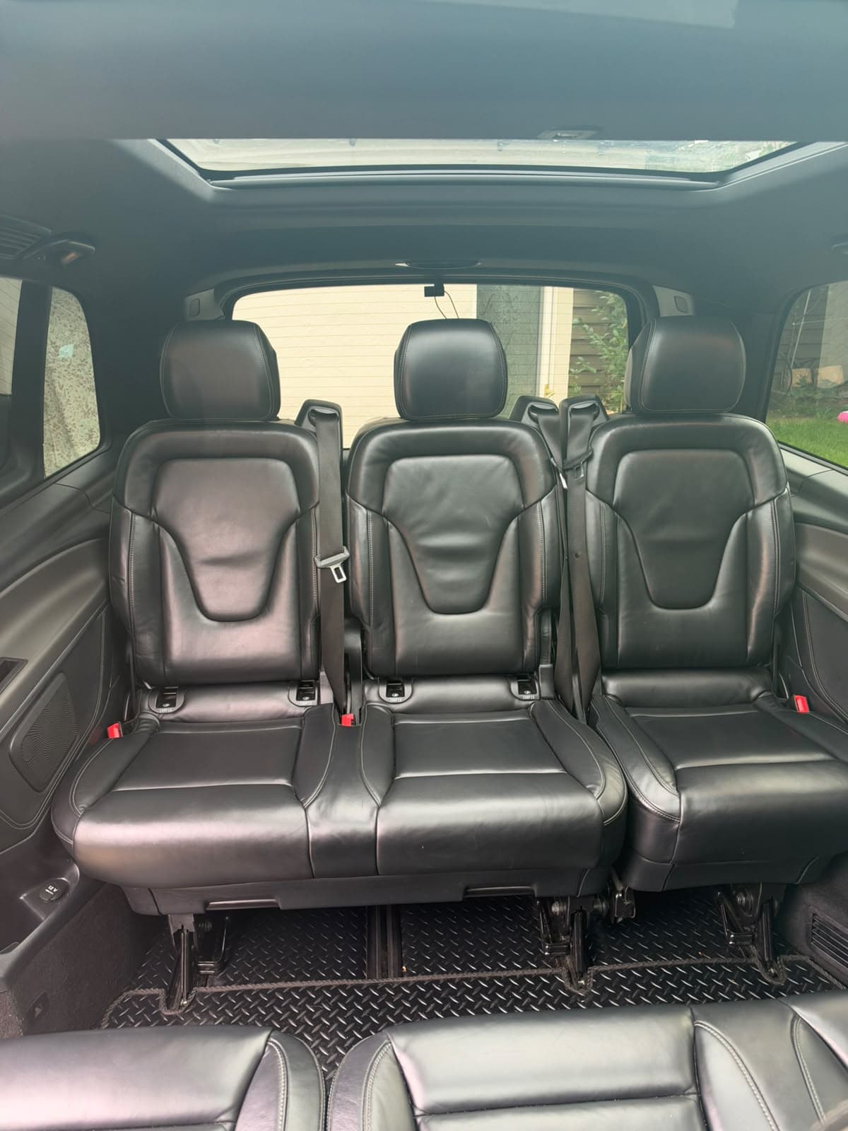 Rear leather passenger seats beneath the glass roof